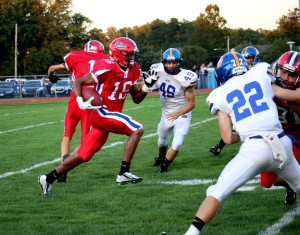 Denzel Hughes, above, made a run in the first quarter of the Neshaminy v. Downingtown West football game.
