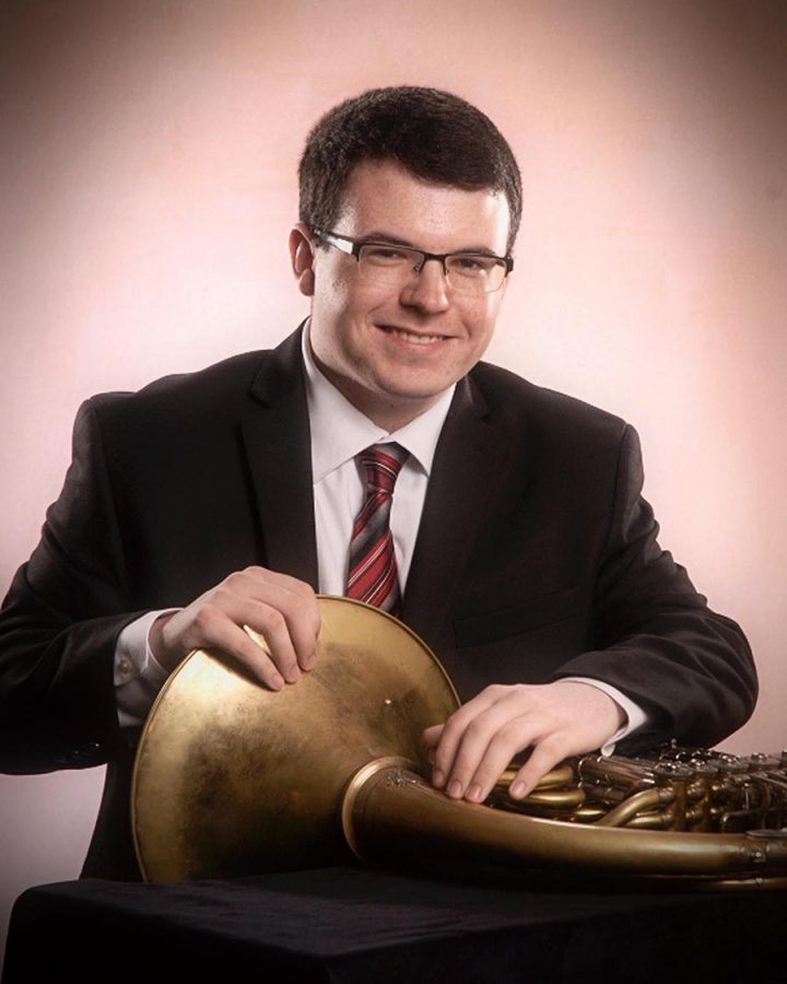Steven Hopkins poses with his beloved french horn for his senior photos.