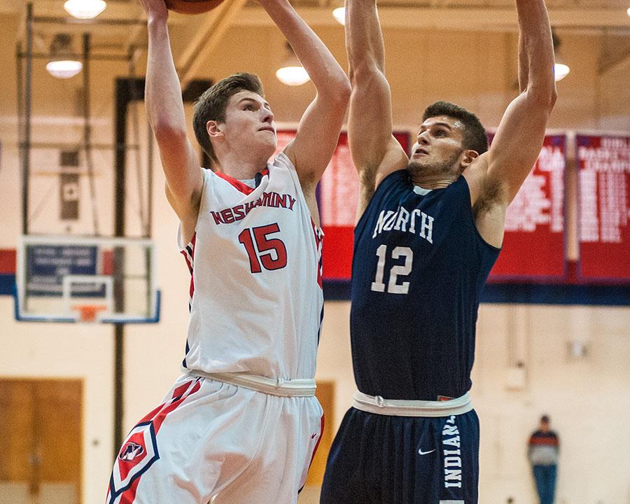 Junior Chris Arcidiacono shoots a layup over a Council Rock North player at a home game.