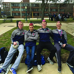 From left, current senior Josh Hartley and prior seniors Luka Kezherashvili, John Stay and Dave Kneiss are at La Salle University for the district one championships last year.