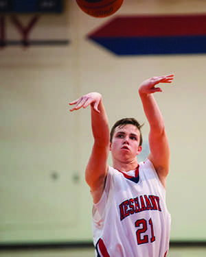 Junior Cameron Jeffers shoots a foul shot. Jeffers balances his role as student and athlete.