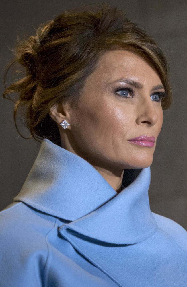 Melania Trump, escorted by a U.S. Marine, walks toward the platform the 58th Presidential Inauguration in Washington, D.C., Jan. 20, 2017. More than 5,000 military members from across all branches of the armed forces of the United States, including reserve and National Guard components, provided ceremonial support and Defense Support of Civil Authorities during the inaugural period. (DoD photo by U.S. Air Force Staff Sgt. Marianique Santos)