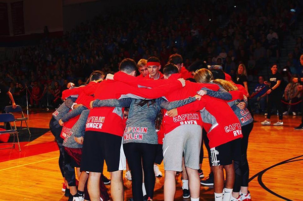 All+of+the+red+captains+huddling+before+the+gym+night+event+began