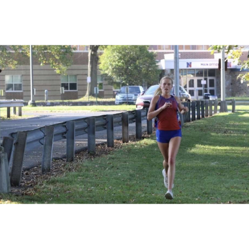Cross Country Runner, Kate Bradish, running a home race on Neshaminy School grounds. 