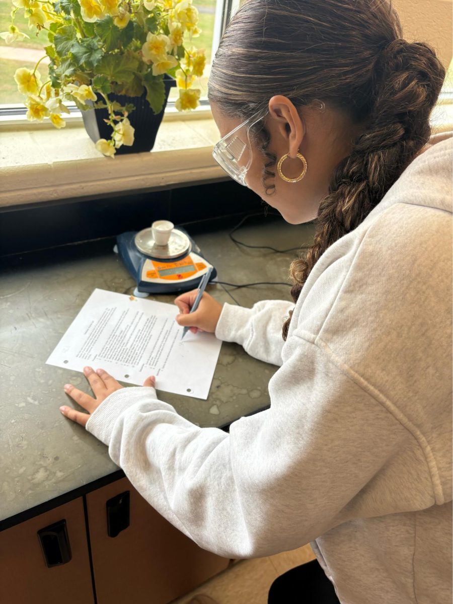 Student Gianna Moreu working on Chemistry lab assignment. Photo taken by Chelsea Koss