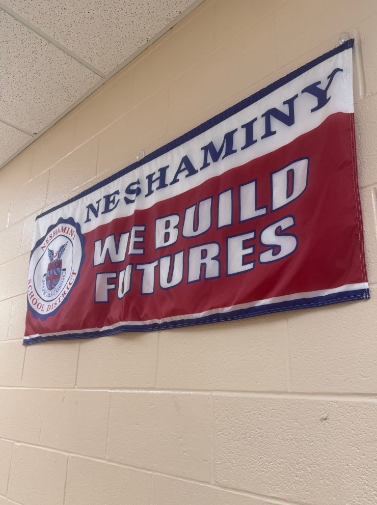  Photo taken of the “We Build Futures” banner hanging in downstairs F-Hall. 
(The Playwickian/Isabelle McLaughlin)