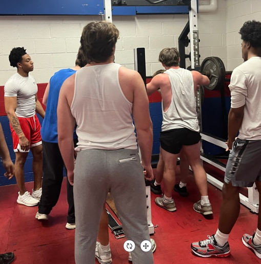 Neshaminy High School football team rallies around their teammate as he lift a new record of weight. (The Playwickian/Emerah Masla)